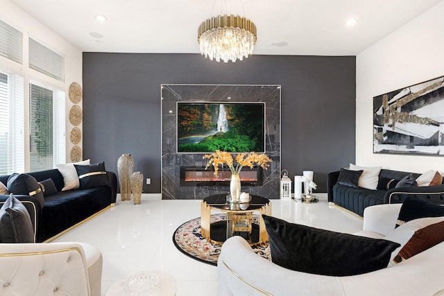 living area featuring recessed lighting, an inviting chandelier, tile patterned flooring, and a premium fireplace