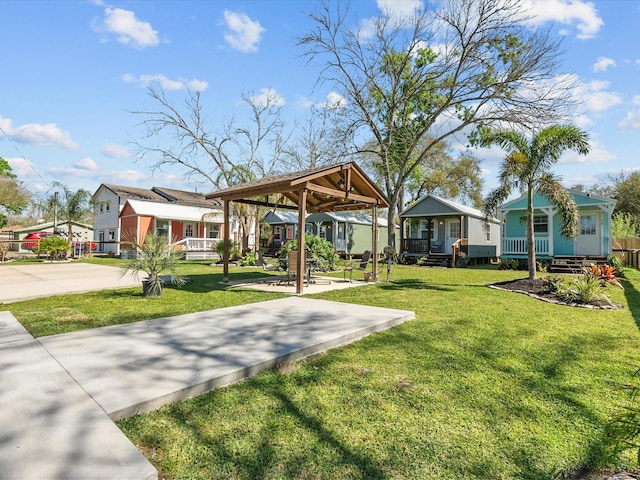 view of community with a lawn and a gazebo