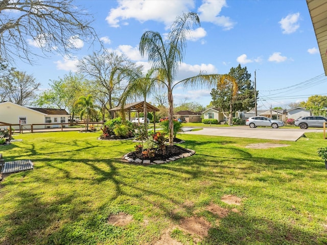 view of yard featuring a gazebo and fence