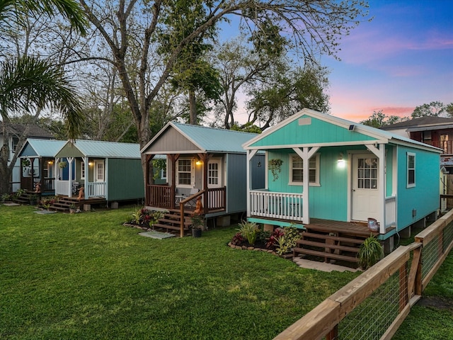 view of front of house with a front lawn and a porch