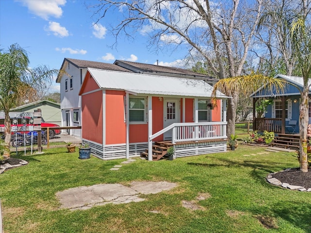 view of front facade with covered porch and a front lawn