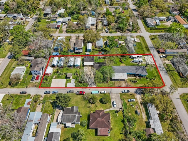 birds eye view of property with a residential view