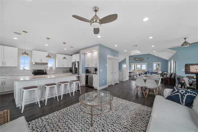 26711 Bay Water Dr, Galveston, TX 77554 - living area with a ceiling fan, plenty of natural light, and lofted ceiling