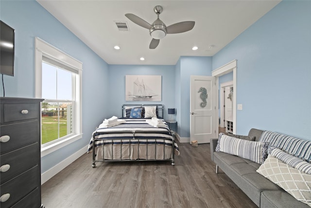 26711 Bay Water Dr, Galveston, TX 77554 - bedroom with visible vents, baseboards, and wood finished floors