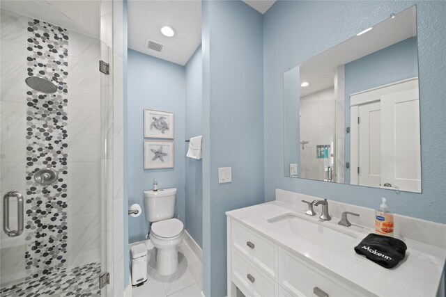 26711 Bay Water Dr, Galveston, TX 77554 - bathroom with a shower stall, vanity, visible vents, and toilet