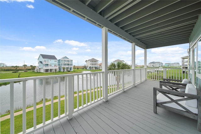 26711 Bay Water Dr, Galveston, TX 77554 - wooden terrace with a lawn, a residential view, and a water view