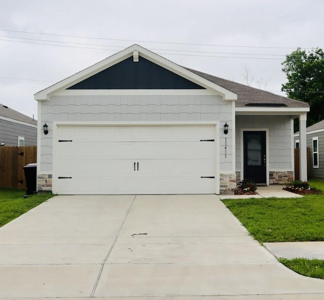 11411 Bright Sun Dr, Houston, TX 77048 - ranch-style house featuring concrete driveway, an attached garage, stone siding, and a shingled roof