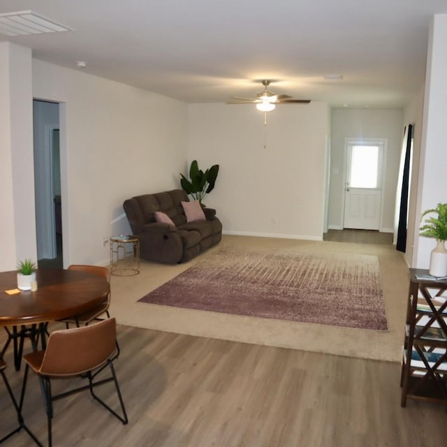 11411 Bright Sun Dr, Houston, TX 77048 - living area with baseboards, a ceiling fan, wood finished floors, and visible vents