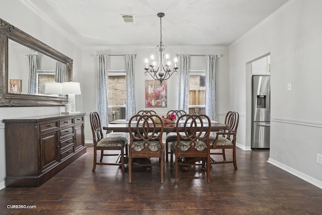 dining area featuring a chandelier, dark wood-style flooring, ornamental molding, and visible vents