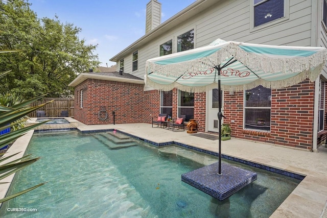view of swimming pool featuring a patio, a fenced in pool, and fence