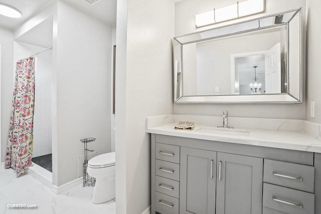 bathroom with baseboards, a shower with curtain, toilet, vanity, and marble finish floor