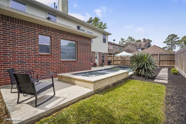 view of yard featuring a fenced in pool, a patio area, and a fenced backyard