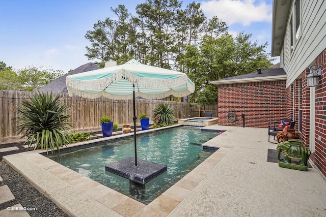 view of pool with a patio, a fenced backyard, and a pool with connected hot tub