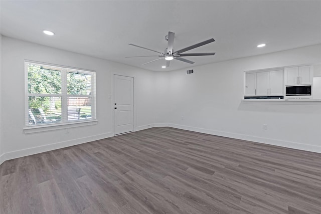 4074 Cheena Dr, Houston, TX 77025 - unfurnished living room featuring baseboards, dark wood-style floors, ceiling fan, and recessed lighting