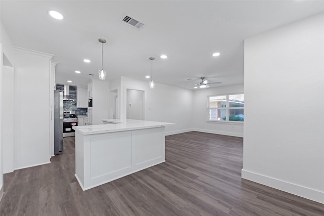 4074 Cheena Dr, Houston, TX 77025 - kitchen with appliances with stainless steel finishes, white cabinetry, baseboards, a ceiling fan, and dark wood finished floors
