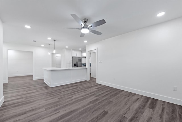 4074 Cheena Dr, Houston, TX 77025 - unfurnished living room featuring baseboards, recessed lighting, dark wood-style floors, and a ceiling fan