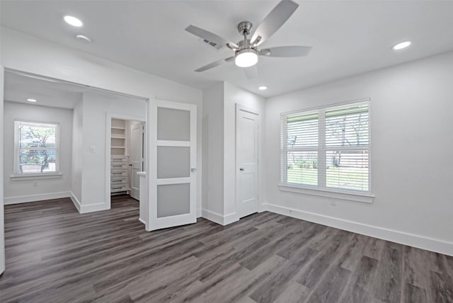 4074 Cheena Dr, Houston, TX 77025 - unfurnished bedroom featuring baseboards, dark wood-style flooring, recessed lighting, a ceiling fan, and a closet