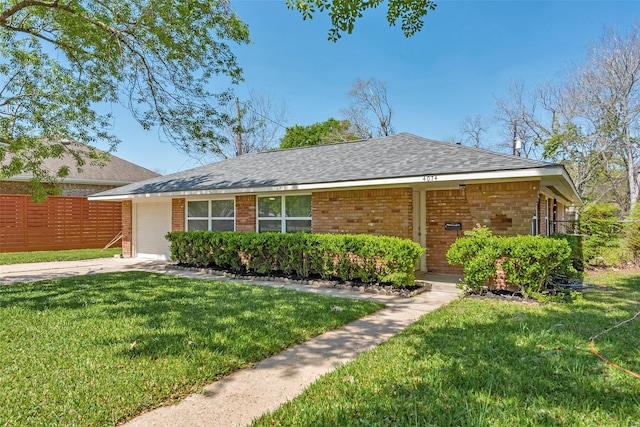 4074 Cheena Dr, Houston, TX 77025 - ranch-style home featuring brick siding, roof with shingles, concrete driveway, and an attached garage