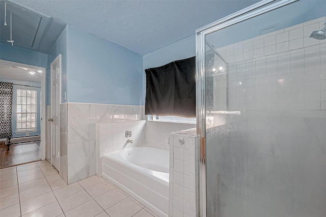 bathroom with tile walls, a textured ceiling, a shower stall, tile patterned floors, and a garden tub