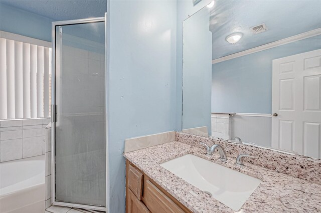 full bath with vanity, crown molding, an enclosed shower, visible vents, and a bath