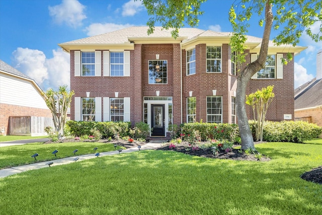 1314 Cross Valley Dr, Sugar Land, TX 77479 - view of front facade with a front lawn and brick siding