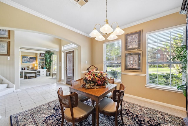 1314 Cross Valley Dr, Sugar Land, TX 77479 - dining area featuring a chandelier, arched walkways, crown molding, baseboards, and light colored carpet