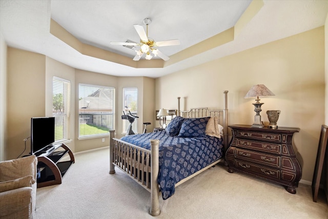 1314 Cross Valley Dr, Sugar Land, TX 77479 - carpeted bedroom featuring baseboards, a raised ceiling, and ceiling fan