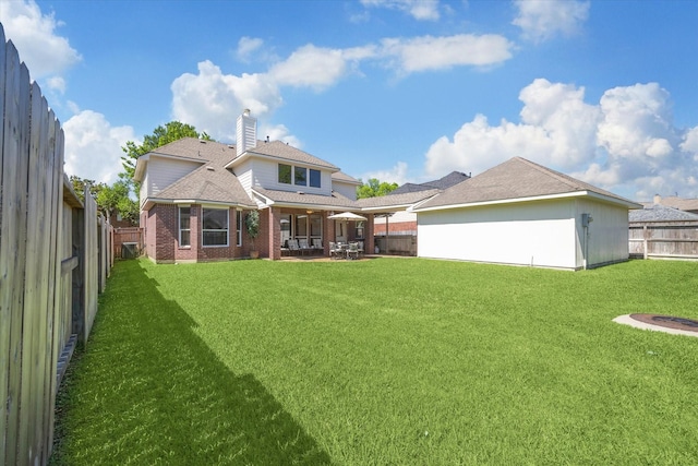 1314 Cross Valley Dr, Sugar Land, TX 77479 - rear view of property with brick siding, a patio, and a chimney