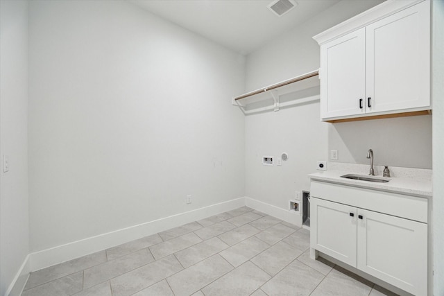 washroom featuring a sink, visible vents, washer hookup, cabinet space, and electric dryer hookup
