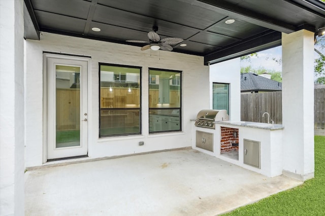 view of patio / terrace with grilling area, area for grilling, ceiling fan, and fence