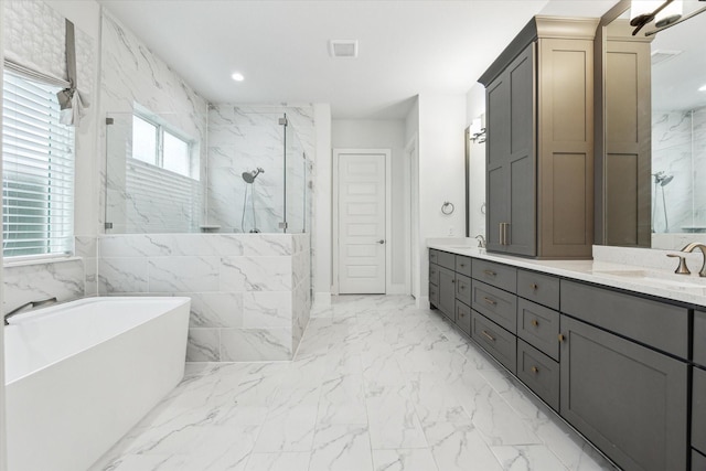 full bathroom with a soaking tub, a sink, a marble finish shower, and double vanity