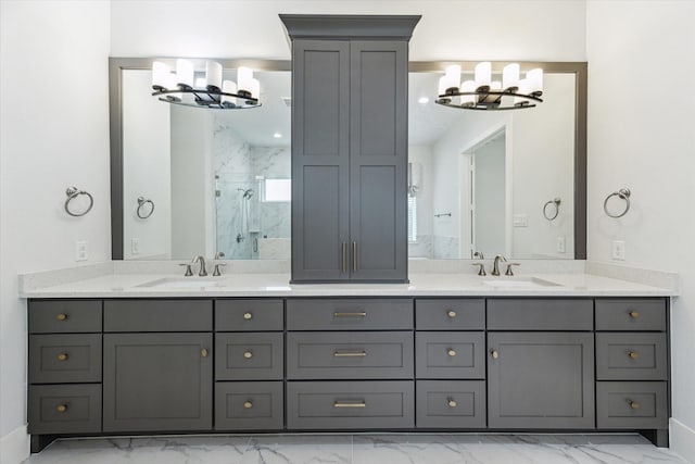 bathroom with marble finish floor, a marble finish shower, and a sink