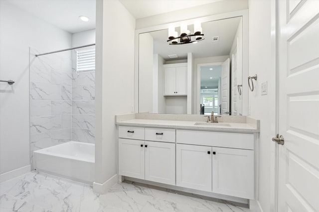 bathroom with marble finish floor, shower / washtub combination, vanity, a wealth of natural light, and baseboards