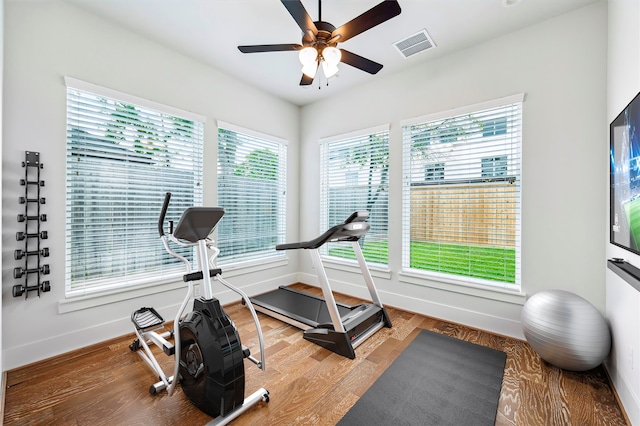 626 Attingham Dr, Houston, TX 77024 - workout room with baseboards, a ceiling fan, and light wood-style flooring
