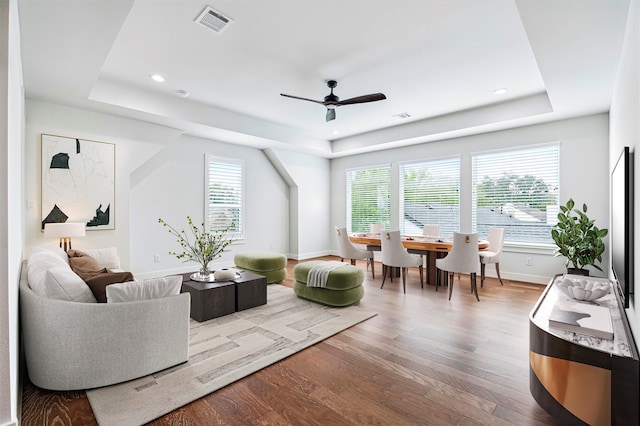 626 Attingham Dr, Houston, TX 77024 - living area with a raised ceiling, wood finished floors, plenty of natural light, and recessed lighting
