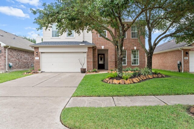 9330 Vander Rock Dr, Houston, TX 77095 - traditional-style house with brick siding, a front yard, driveway, and an attached garage