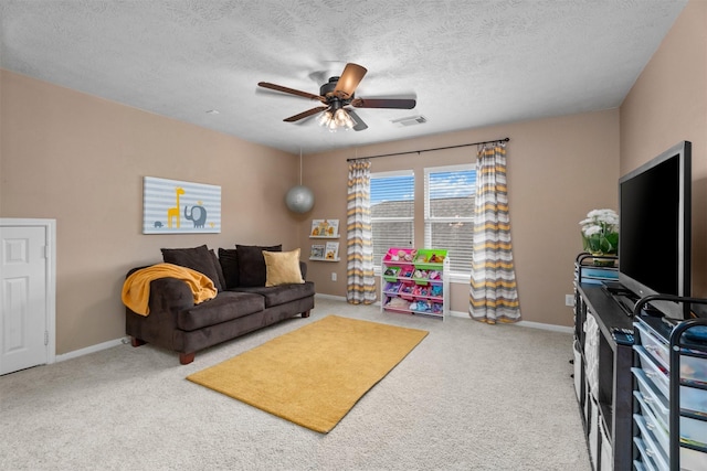 9330 Vander Rock Dr, Houston, TX 77095 - carpeted living room with a textured ceiling, visible vents, a ceiling fan, and baseboards