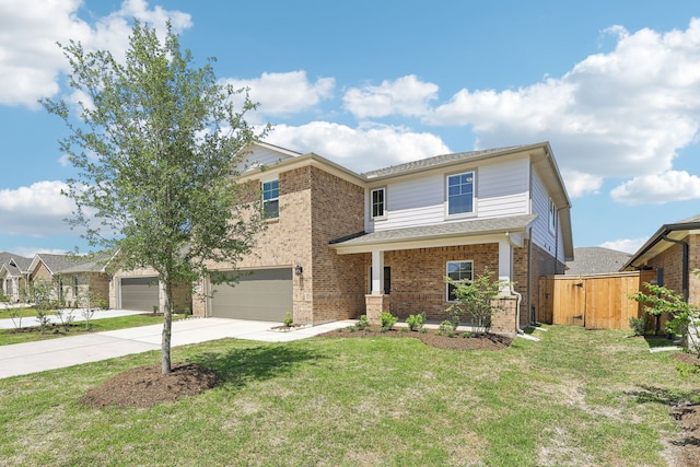 traditional home with driveway, an attached garage, fence, a front yard, and brick siding