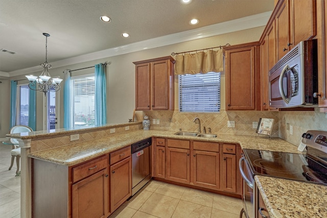 343 Old Aqua Lndg E, Conroe, TX 77356 - kitchen featuring a sink, a chandelier, a peninsula, brown cabinetry, and stainless steel appliances