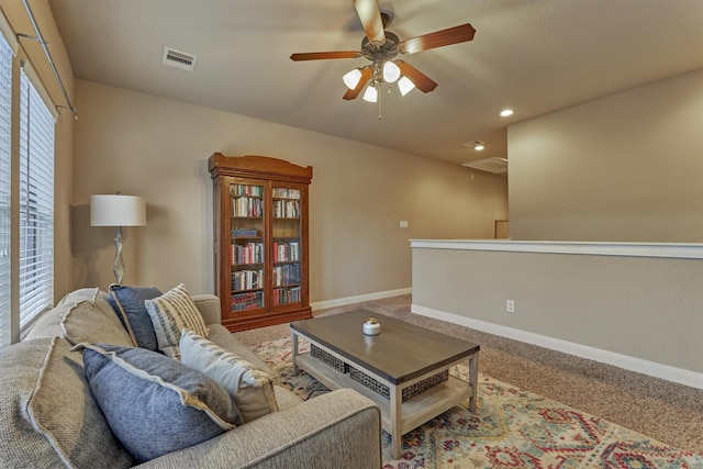 343 Old Aqua Lndg E, Conroe, TX 77356 - carpeted living area with visible vents, baseboards, ceiling fan, recessed lighting, and attic access