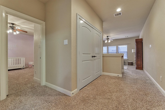 343 Old Aqua Lndg E, Conroe, TX 77356 - hall with baseboards, carpet floors, an upstairs landing, and visible vents