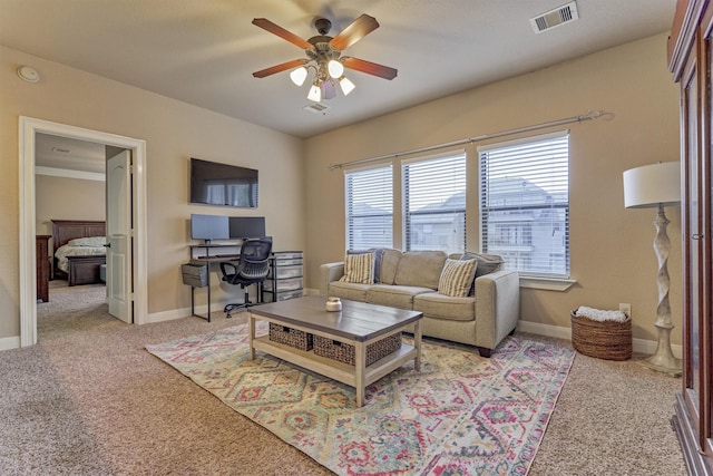 343 Old Aqua Lndg E, Conroe, TX 77356 - living area featuring baseboards, visible vents, carpet, and a ceiling fan