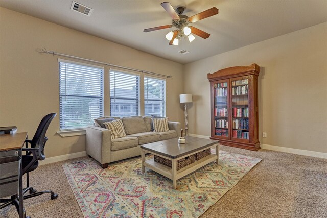 343 Old Aqua Lndg E, Conroe, TX 77356 - living room with baseboards, visible vents, carpet floors, and a ceiling fan