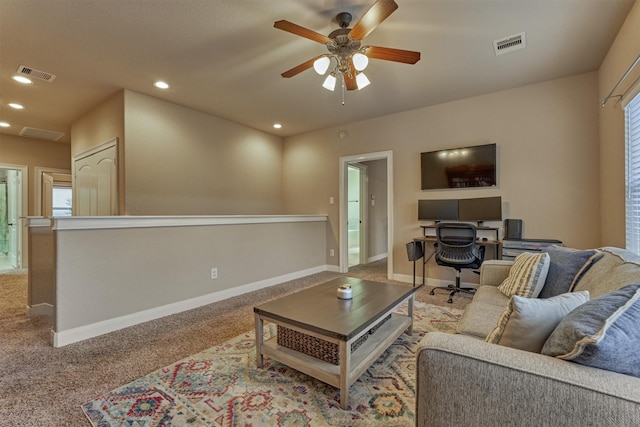 343 Old Aqua Lndg E, Conroe, TX 77356 - carpeted living room featuring baseboards, visible vents, and a ceiling fan
