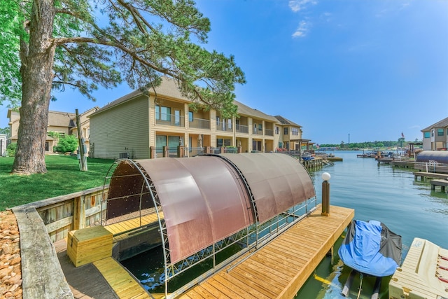 343 Old Aqua Lndg E, Conroe, TX 77356 - view of dock featuring a water view and a yard