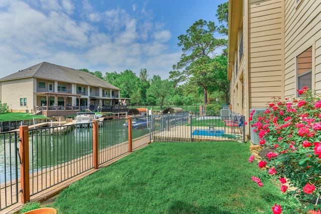 343 Old Aqua Lndg E, Conroe, TX 77356 - view of yard featuring a water view and fence