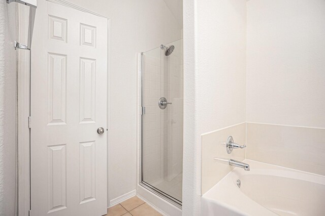 2522 Barton Springs St, League City, TX 77573 - bathroom featuring tile patterned flooring, a shower stall, and a bath