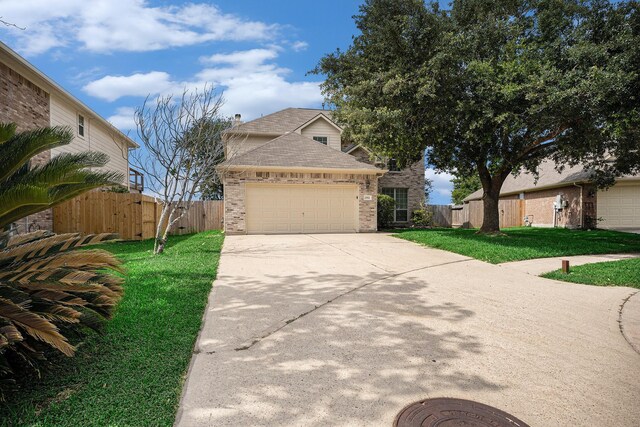 2522 Barton Springs St, League City, TX 77573 - view of front of house with a garage, brick siding, driveway, and a shingled roof