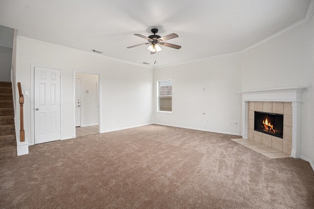 2522 Barton Springs St, League City, TX 77573 - unfurnished living room with carpet flooring, stairway, a tile fireplace, ornamental molding, and ceiling fan