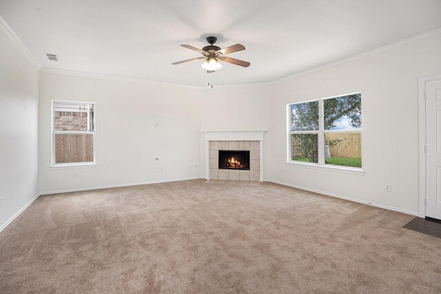 2522 Barton Springs St, League City, TX 77573 - unfurnished living room with ornamental molding, carpet, a ceiling fan, a fireplace, and baseboards